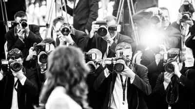 a group of people taking pictures with cameras at Residence Aout 31 in Cannes
