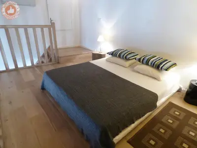 a bedroom with a large bed with pillows on it at ALC - A523 - 4 min Palais and Beaches in Cannes
