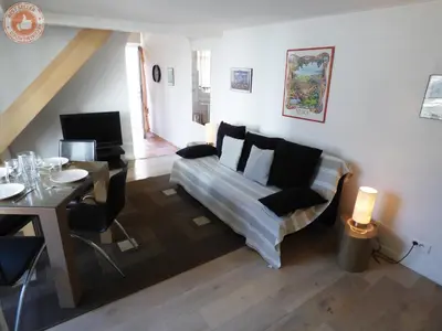 a living room with a couch and a table at ALC - A523 - 4 min Palais and Beaches in Cannes