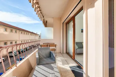 a balcony with a view of a building at Le Petit Fleury – Balcony, Calm in Cannes in Cannes