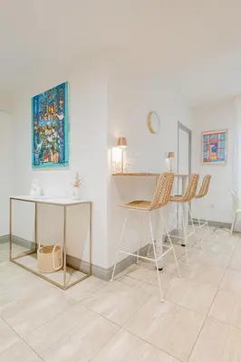 a dining room with a table and chairs at La Perle du Suquet, zone piétonne in Cannes