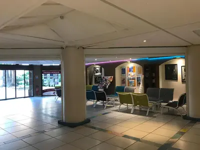 a lobby with chairs and tables in a building at Cannes, La Palme d'Or in Cannes