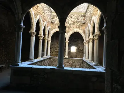 an empty crypt with columns and arches in a building at Cannes, La Palme d'Or in Cannes