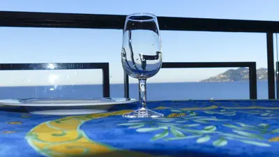 a wine glass sitting on top of a table at Cannes, La Palme d'Or in Cannes
