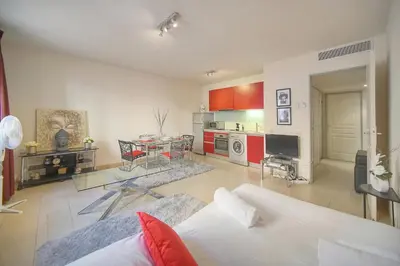 a large living room with a couch and a table at Immogroom - T2 - AC - Suquet in Cannes