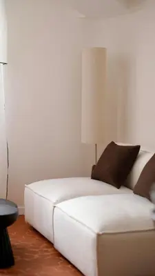 a white couch in a room with a lamp at Exceptional facing Palais Cannes 3 in Cannes