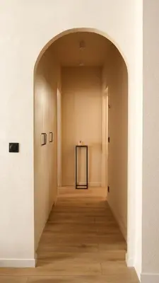 an empty hallway with an archway in a building at Exceptional facing Palais Cannes1 in Cannes