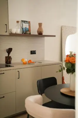 a kitchen with a table and a counter top at Exceptional facing Palais Cannes1 in Cannes