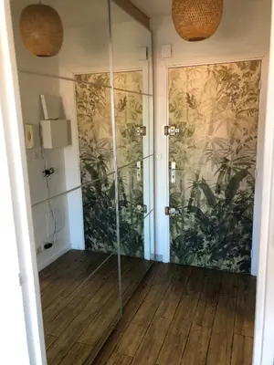 a shower with glass doors in a bathroom at Studio and breakfast in Cannes