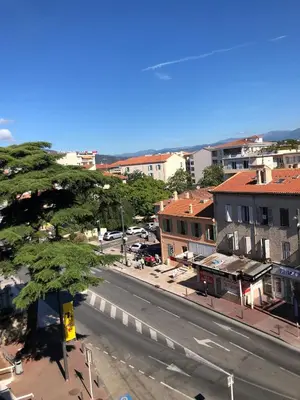 an empty street in a city with buildings at Studio and breakfast in Cannes