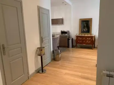 a room with a hallway with a door and a wooden floor at 3P Cannes Centre 2min Palais des Festivals,Rue du Antibe location in Cannes