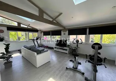 a living room with a couch and exercise equipment at Grande Villa Cannes Centre havre de paix in Cannes