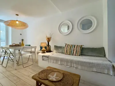 a living room with a couch and a table at Tredici By SCLS Locations in Cannes