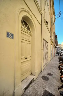 a door on the side of a building on a street at Studio Cannes in Cannes