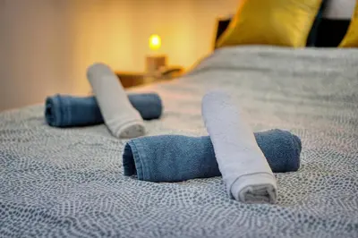 a group of rolled up towels on a bed at Le 8 - Cannes in Cannes