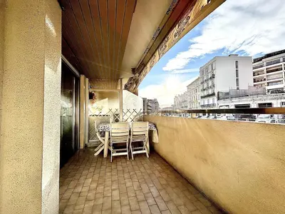 a balcony with a table and chairs on it at Cannes 1 Bedroom Apartment - CC1 in Cannes