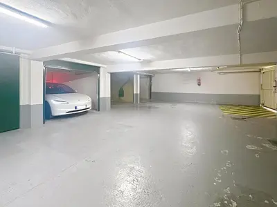 an empty garage with a car parked in it at 39m2 Croisette, terrasse, vue mer, garage in Cannes