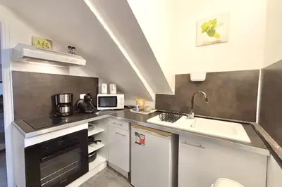 a small kitchen with a sink and a microwave at Luminous T2 on the seafront in Cannes