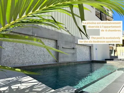 a living room with a table and some chairs at Luxury Apartment - Central Cannes, near Beach & Palais - LRACANNES in Cannes