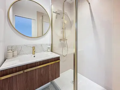 a bathroom with a sink and a mirror at 54m2 hypercenter, face Palais des Festivals in Cannes