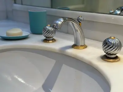 a bathroom sink with a chrome bathroom faucet at Residence Palais Miramar in Cannes