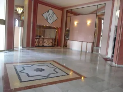 a large lobby with a tile floor and a room at Residence Palais Miramar in Cannes