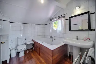 a bathroom with a tub and a toilet and a sink at Kathleen CANNES-GOLFE JUAN in Vallauris