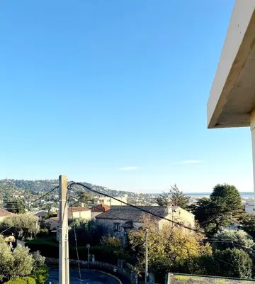 a view of a city from a house at 3 pièces cocon dans les hauteurs de Cannes vue mer in Le Cannet