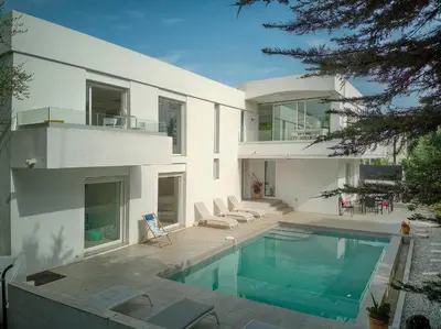 a large white house with a swimming pool at FRGK 