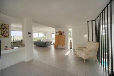 a living room with a chair and a couch at FRGK 