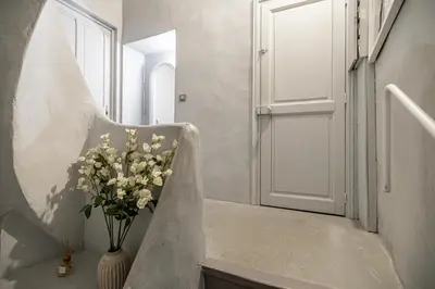 a vase of flowers is sitting on the stairs at Croisette Cannes 2 in Cannes
