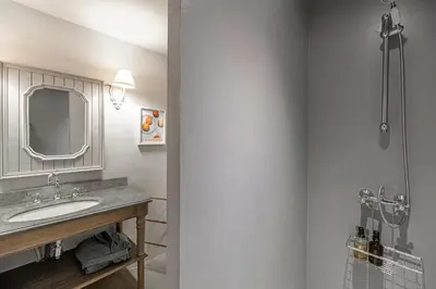 a bathroom with a sink and a mirror at Croisette Cannes 2 in Cannes