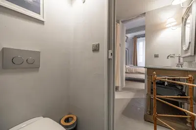 a bathroom with a toilet and a sink at Croisette Cannes 2 in Cannes