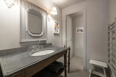 a bathroom with a sink and a mirror at Croisette Cannes 2 in Cannes
