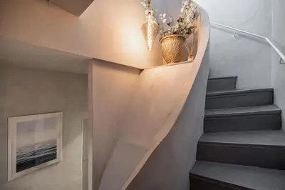 a staircase in a house with a vase on it at Croisette Cannes 2 in Cannes