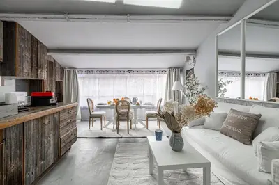 a living room with a white couch and a table at Croisette Cannes duplex in Cannes