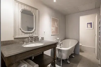 a bathroom with a tub and a sink and a bath tub at Croisette Cannes duplex in Cannes