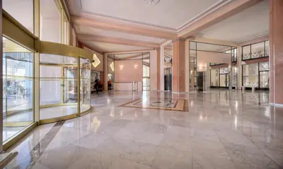 a large lobby with glass windows and a large floor at Cannes 1 bedroom apartment - M6 in Cannes