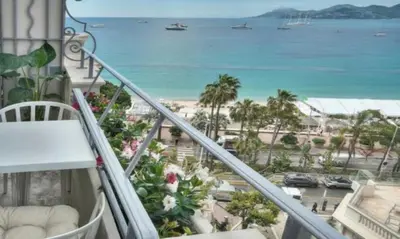 a balcony with a view of the beach and the ocean at Cannes 1 bedroom apartment - M6 in Cannes