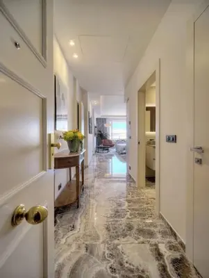 a hallway with a door and a room with a table at Cannes 1 bedroom apartment - M6 in Cannes