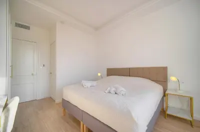 a bedroom with a bed with two stuffed animals on it at Luxueux 3 chambres BALCON, CARRE D'OR- COEUR DE CANNES A3B129 in Cannes