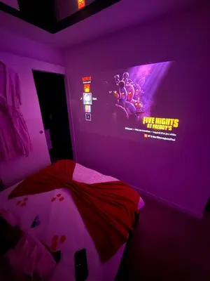 a purple bedroom with a poster on the wall at Romantic Room - Jaccuzi Privé -Appartement Cannes in Cannes