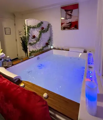a large pool of water in a living room at Romantic Room - Jaccuzi Privé -Appartement Cannes in Cannes