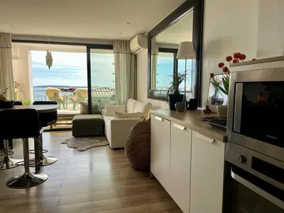 a kitchen with a living room with a view at Cannes Passion in Cannes