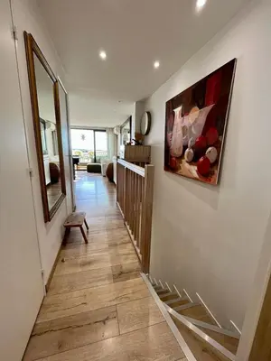 a hallway of a house with a painting on the wall at Cannes Passion in Cannes