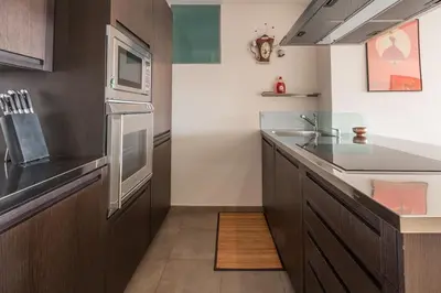 a kitchen with a sink and a counter top at Luxury Croisette Sea view facing Palais in Cannes
