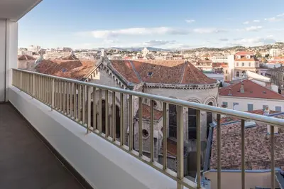 a balcony with a view of a city at Luxury Croisette Sea view facing Palais in Cannes