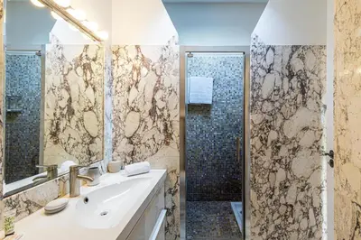 a bathroom with a sink and a shower at 13 ANDRE2 - Very nice duplex apartment, 100m from La Croisette and beaches in Cannes