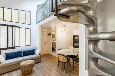 a living room with a couch and a table at 13 ANDRE2 - Very nice duplex apartment, 100m from La Croisette and beaches in Cannes