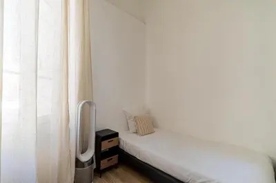 a room with two beds and a window at 13 ANDRE2 - Very nice duplex apartment, 100m from La Croisette and beaches in Cannes